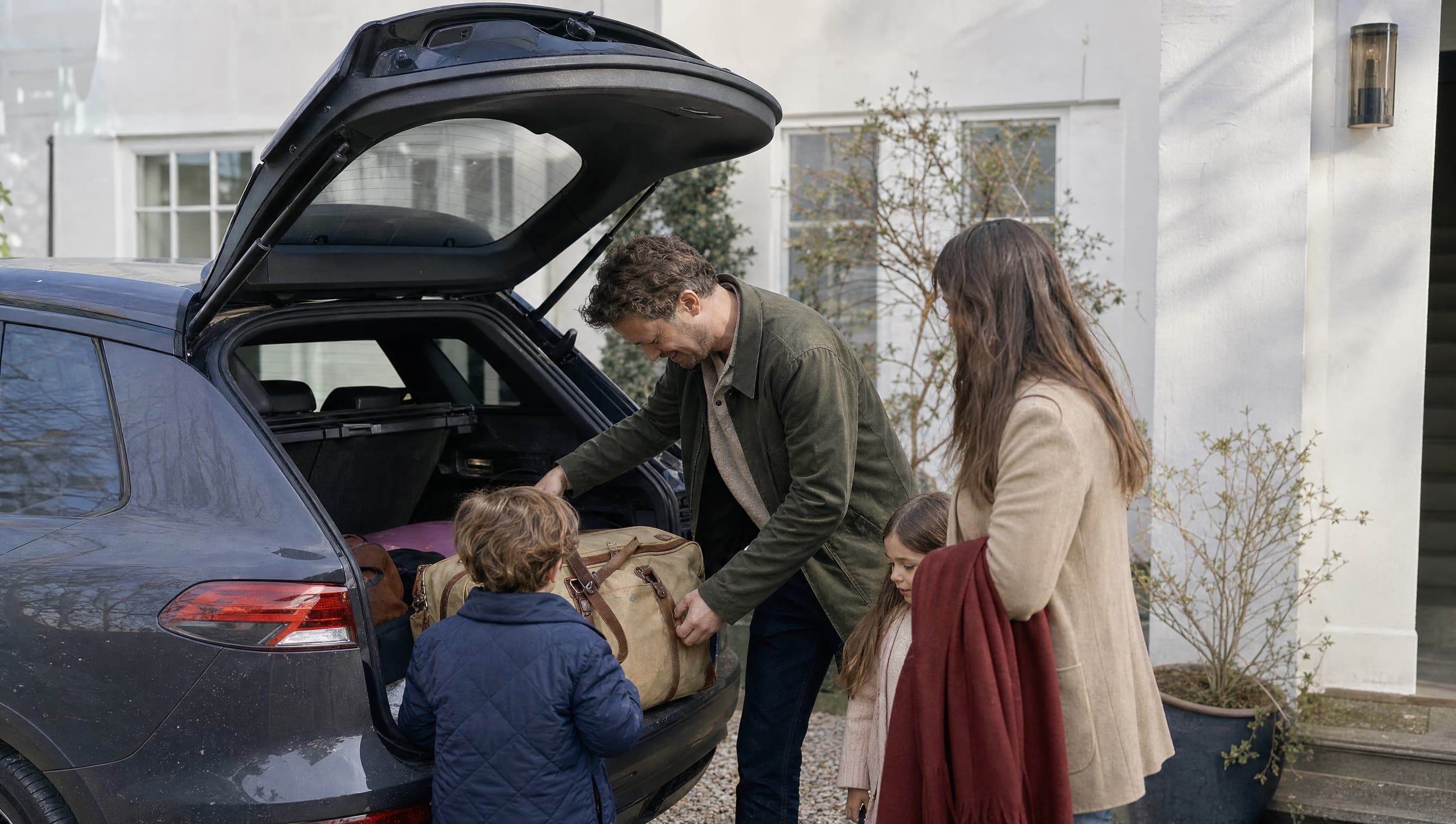 A family preparing to travel in their car